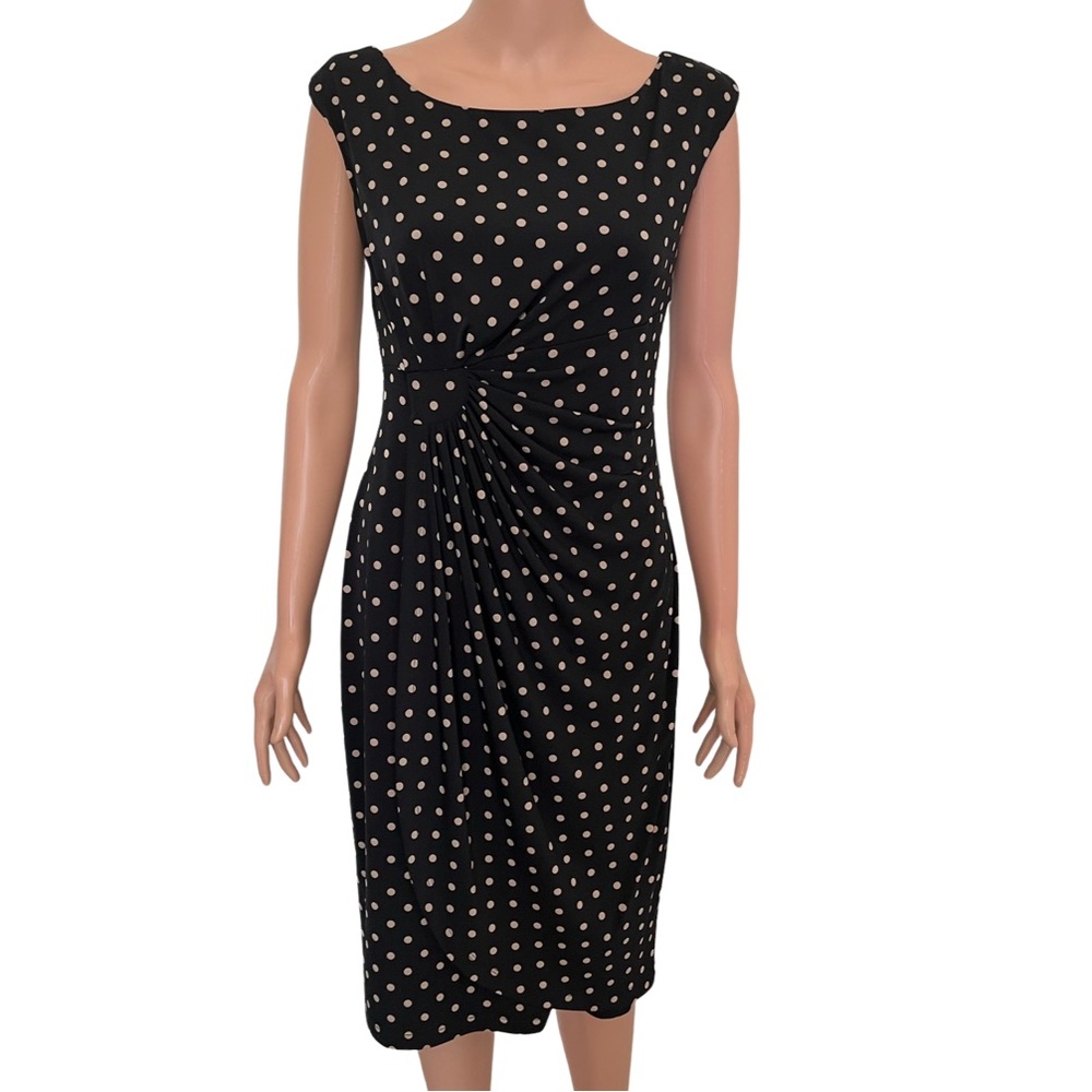 Black faux wrap dress with tan polka dots.